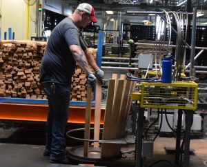 A Barrel Raiser at Jack Daniels Cooperage Adds Two More Staves to the Barrel He is Making